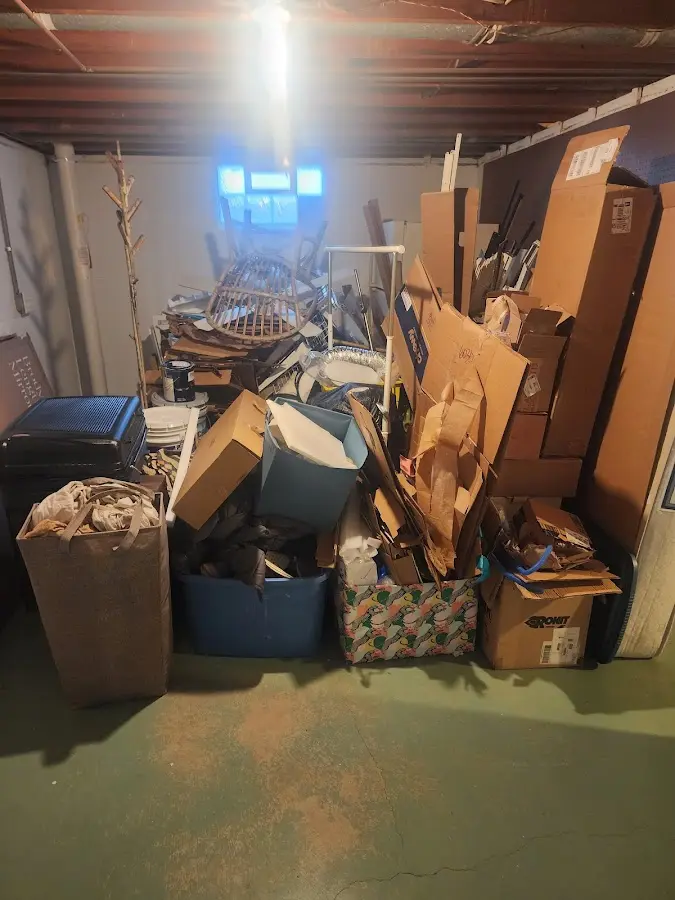 Roll-off dumpster container at job site for Yard Waste Dumpster Rental in Otis Orchards-East Farms